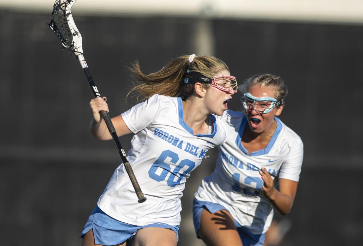 Corona del Mar's Haile Franklin, right, celebrates with Shelby Glabman, left, after Glabman scored a goal against Canyon.