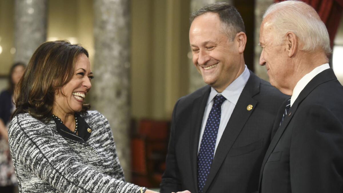 Kamala Harris, with husband Douglas Emhoff, greets then-Vice President Joe Biden in January 2017.