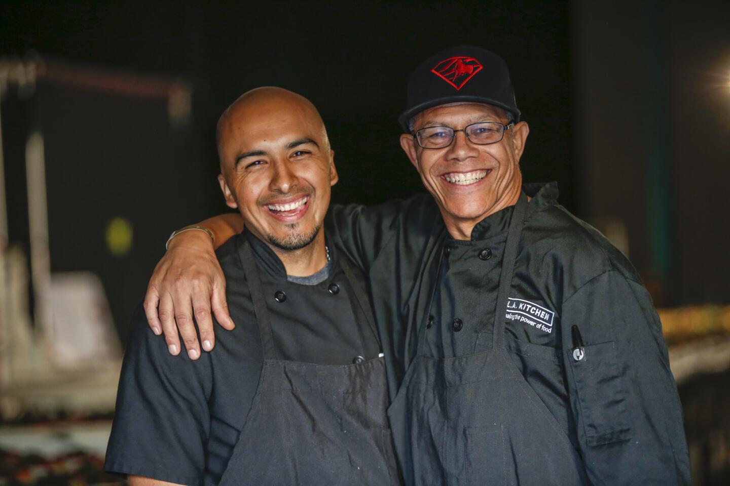 Edgar Ulisses Flores, left, and James Rich were trained by L.A. Kitchen, whose students include the formerly incarcerated or homeless. The men were part of the small army preparing the meal for the Emmys Governors Ball.