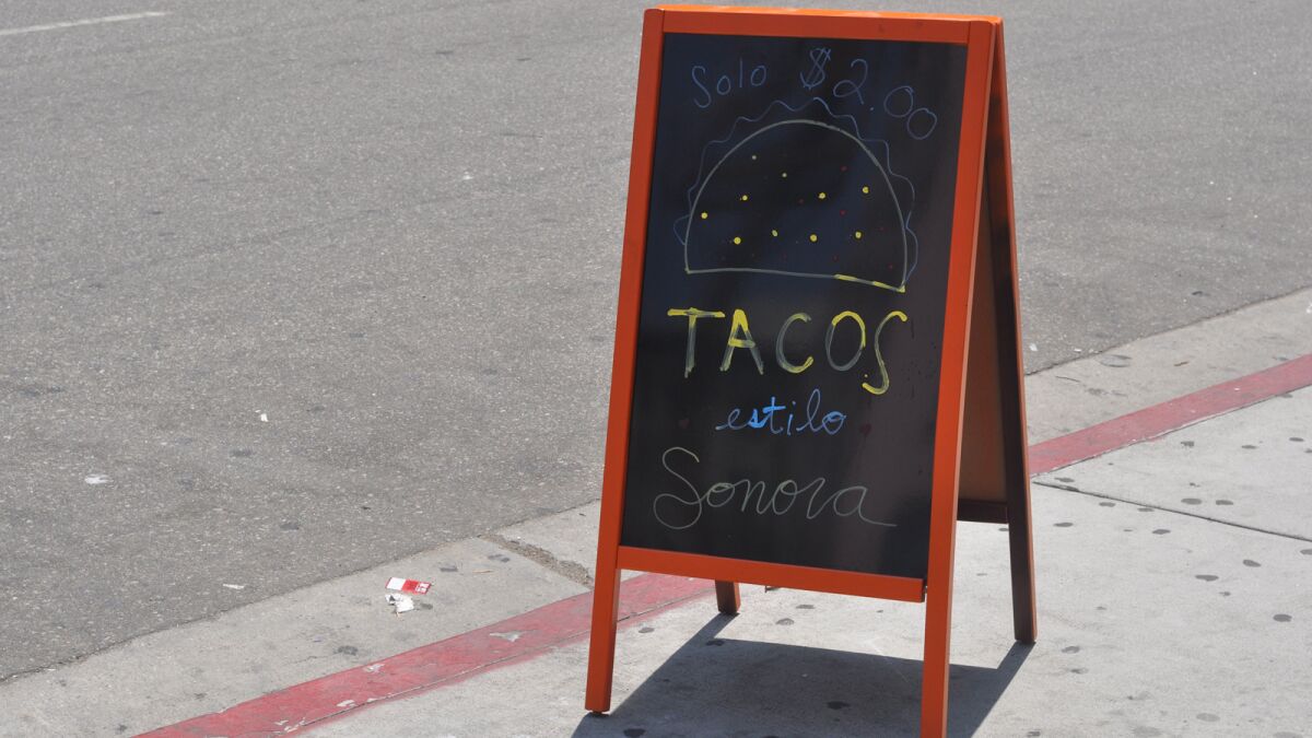 A sign out front simply advertises $2 tacos at Sonoratown in downtown Los Angeles.