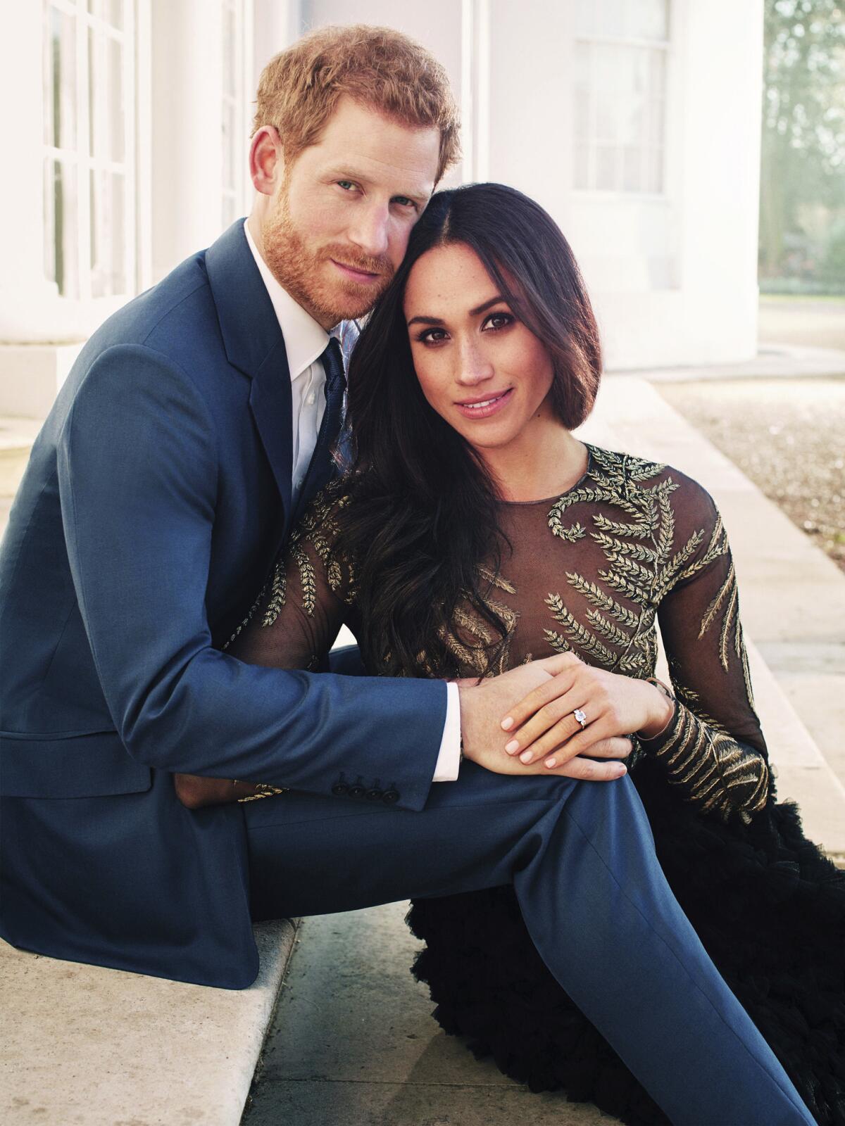Britain's Prince Harry and Meghan Markle pose for one of two official engagement photos.