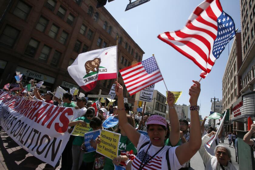 Several hundred people marched in downtown Los Angeles in support of comprehensive immigration reform.