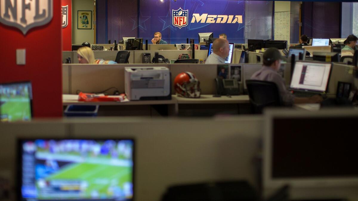 Employees at NFL Digital Media work in the newsroom on in 2015 in Culver City. People working in information businesses have seen among the biggest pay increases since last April. (Gina Ferazzi / Los Angeles Times)