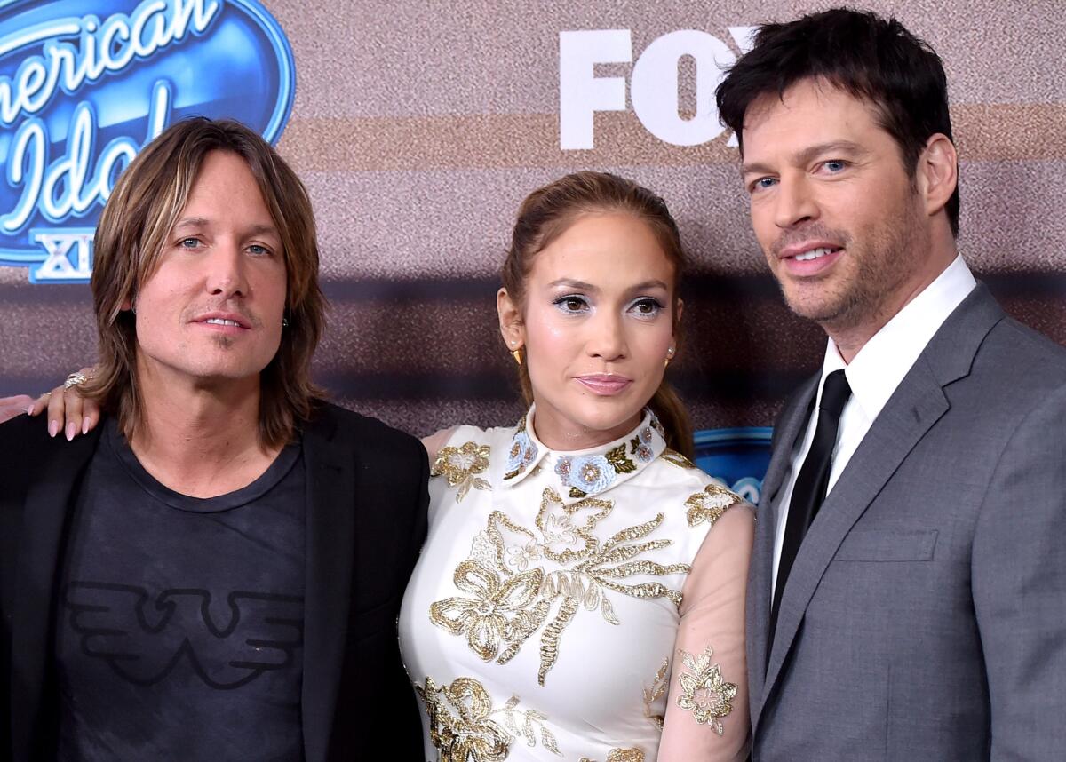 Musician Keith Urban, singer/actress Jennifer Lopez and musician Harry Connick Jr. arrive at Fox TV's "American Idol XIV" finalist party at The District in Los Angeles, California.