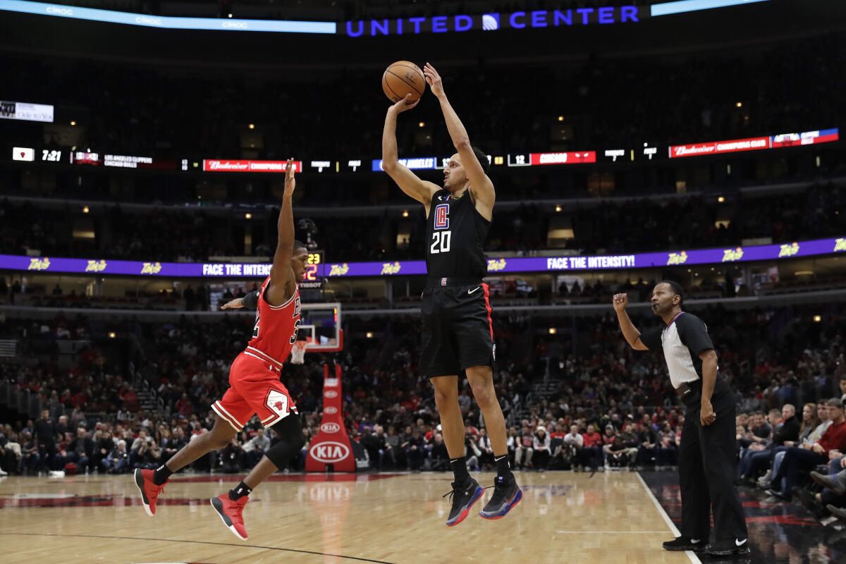Clippers guard Landry Shamet shoots over Bulls forward Kris Dunn during the first half of a game Dec. 14.