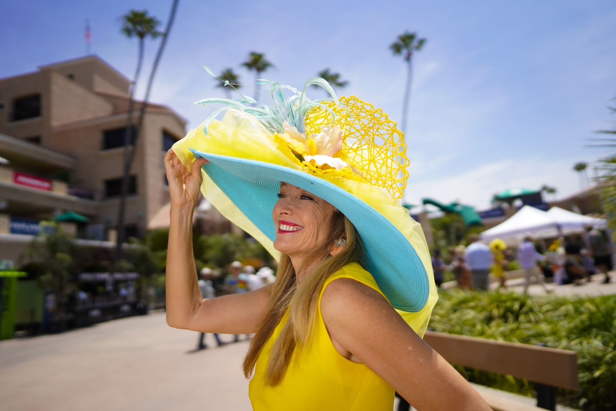 Susan Leonard from Solana Beachwas among the race fans taking part in the tradition of wearing hats on opening day.