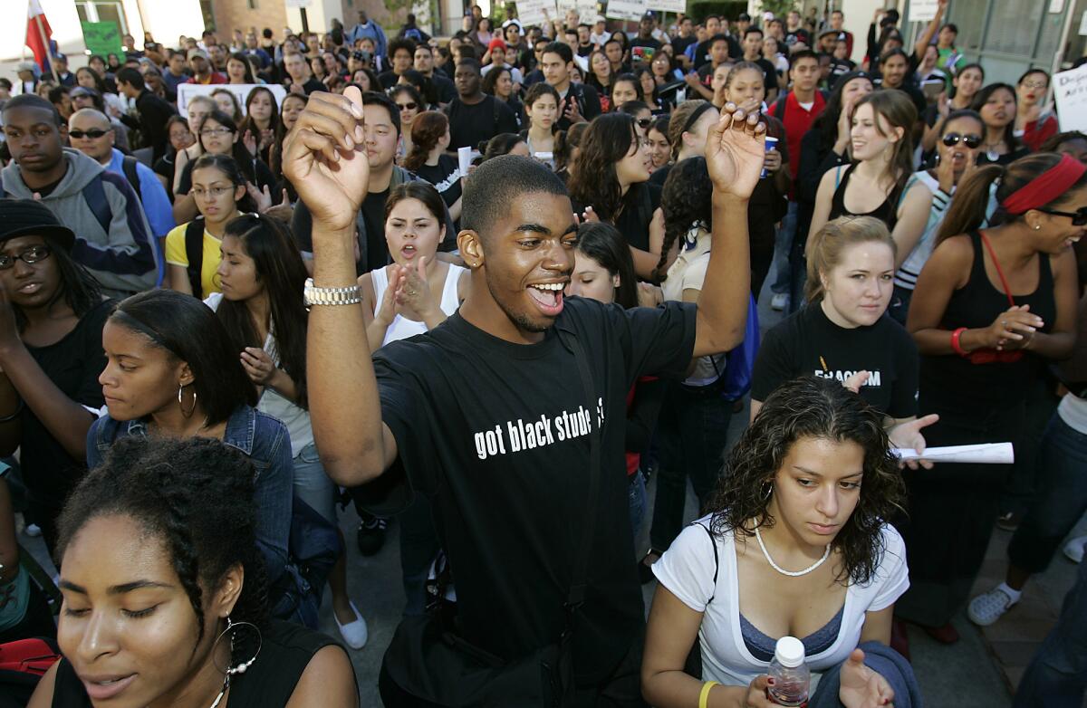 UCLA freshman D'Juan Farmer marches with students against Proposition 209 on the UCLA campus in Westwood in November 2006.