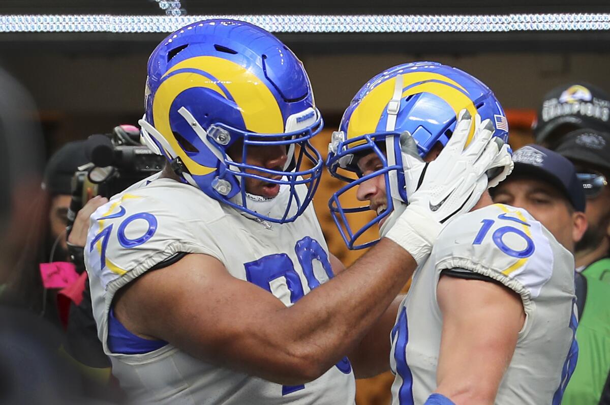 Rams offensive tackle Joe Noteboom, left, celebrates with Rams wide receiver Cooper Kupp.