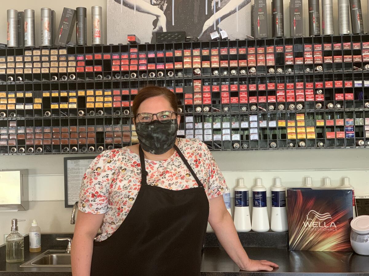 Business has rebounded at Tamara Ybarra's salon in Oshkosh, but she worries that the coronavirus still poses a threat.