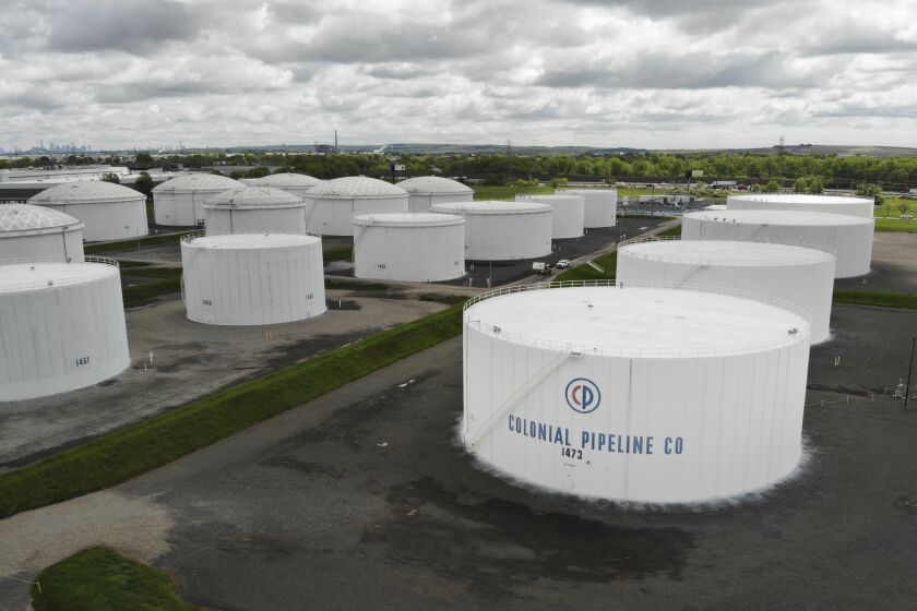 Colonial Pipeline storage tanks are seen in Woodbridge, N.J., Monday, May 10, 2021. Gasoline futures are ticking higher following a cyberextortion attempt on the Colonial Pipeline, a vital U.S. pipeline that carries fuel from the Gulf Coast to the Northeast. (AP Photo/Ted Shaffrey)