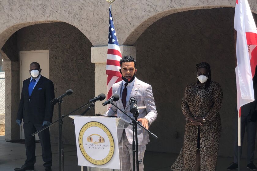 Civil Rights activist Shane Harris, flanked by other Black community advocates, called for San Diego County to pursue a more ambitious proposal for an Office of Equity and Racial Justice on June 22, 2020.