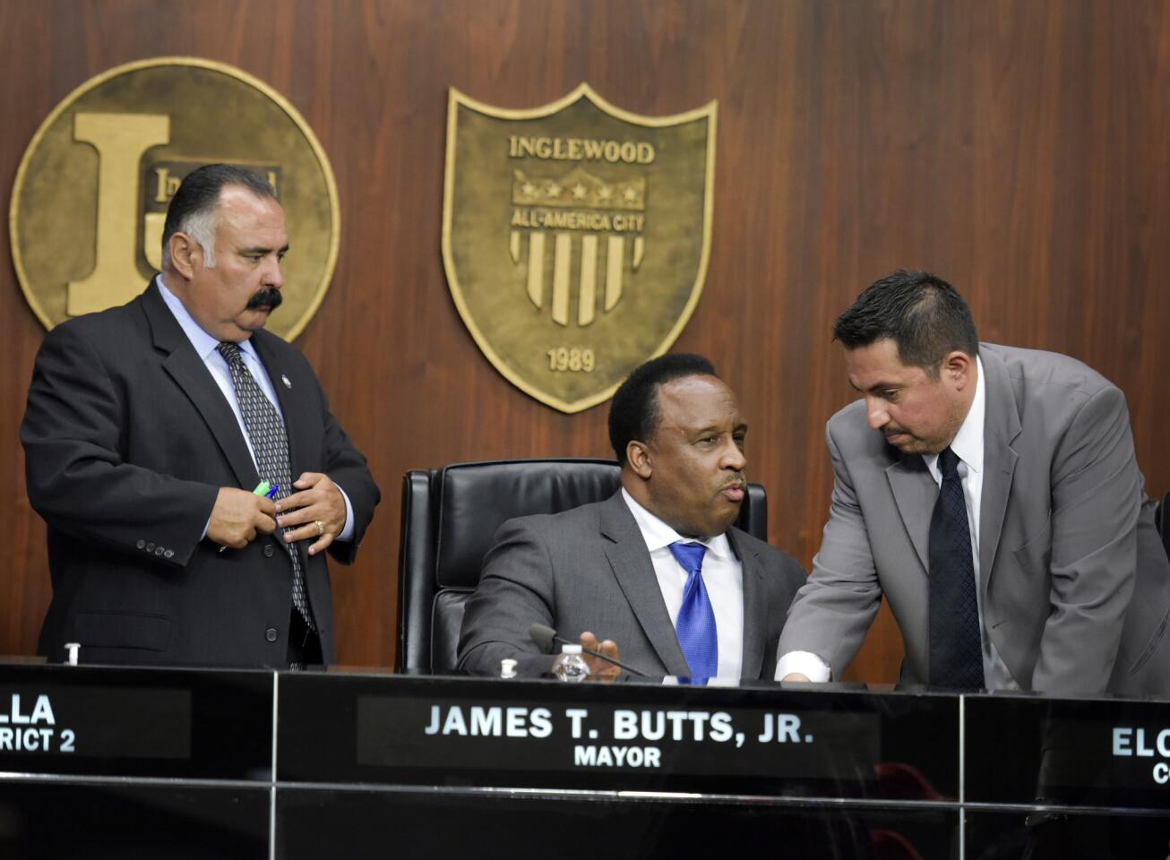 Inglewood Mayor James T. Butts Jr., center, chats with Councilmen Eloy Morales Jr., right, and Alex Padilla during a meeting March 10, 2015.