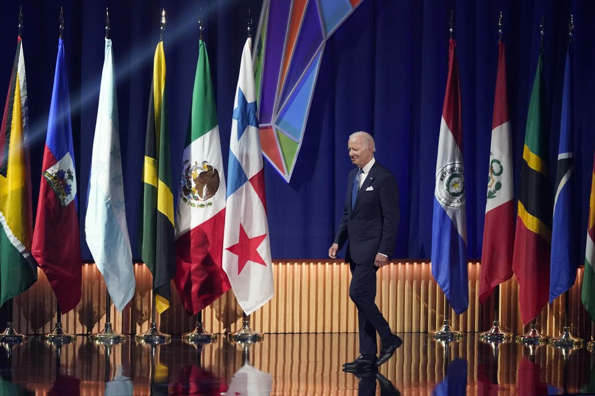 President Biden walks on stage during the opening ceremony at the Summit of the Americas