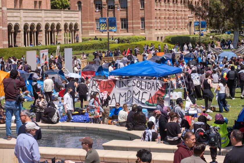 Los Angeles, CA - April 25: Pro-Palestine protesters gather at an encampment on the campus of UCLA at UCLA Thursday, April 25, 2024 in Los Angeles, CA. (Ringo Chiu / For The Times)