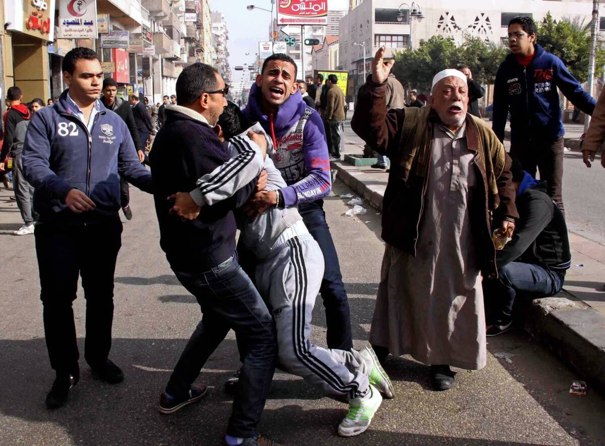 Relatives and supporters react to the death sentences given 21 soccer fans for a Port Said stadium riot in Feburary that left 74 dead.