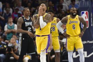 Los Angeles Lakers guard D'Angelo Russell (1) reacts during the second half of Game 2 in a first-round NBA basketball playoff series against the Memphis Grizzlies Wednesday, April 19, 2023, in Memphis, Tenn. (AP Photo/Brandon Dill)
