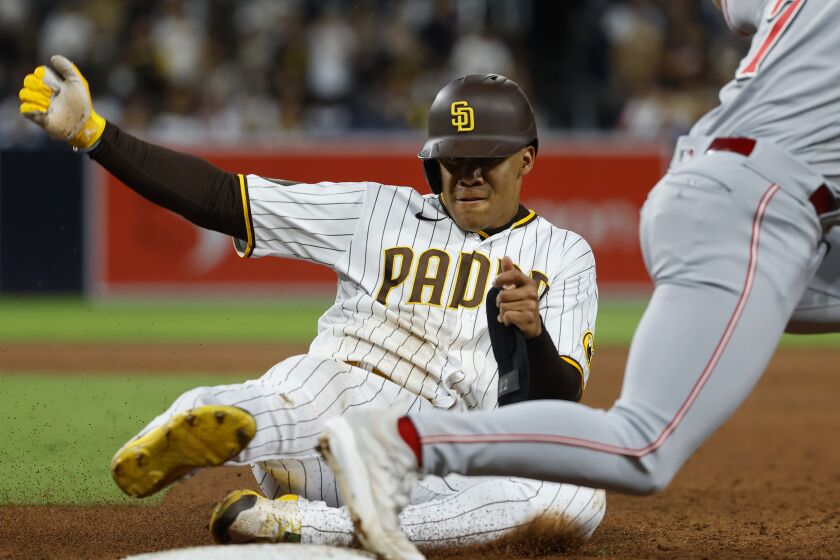 San Diego, CA - May 1: San Diego Padres' Juan Soto is forced out at first base by Cincinnati Reds' Spencer Steer after a Xander Bogaerts fly ball in the third inning at Petco Park on Monday, May, 2023 in San Diego, CA. (K.C. Alfred / The San Diego Union-Tribune)