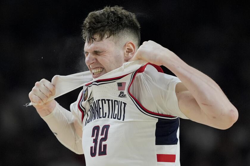UConn center Donovan Clingan (32) reacts to a foul call during the second half of the NCAA college Final Four championship basketball game against Purdue, Monday, April 8, 2024, in Glendale, Ariz. (AP Photo/David J. Phillip)