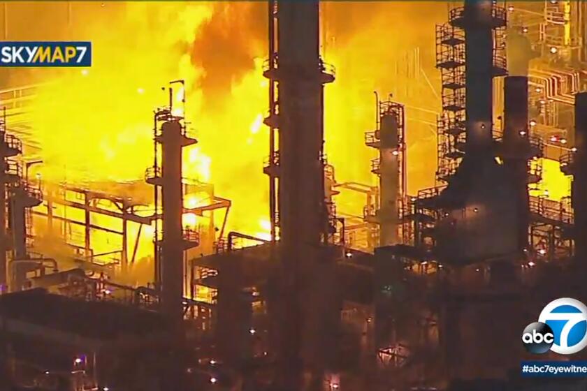 This Tuesday, Feb. 25, 2020, photo taken from KABC-TV video shows a fire at a large refinery at the Marathon Petroleum refinery in the city of Carson, Calif., south of Los Angeles. Firefighters were still pouring water onto part of the refinery early Wednesday but large flames from the fire had disappeared. No injuries were reported. Authorities could not immediately say what sparked the fire. (KABC-TV via AP)
