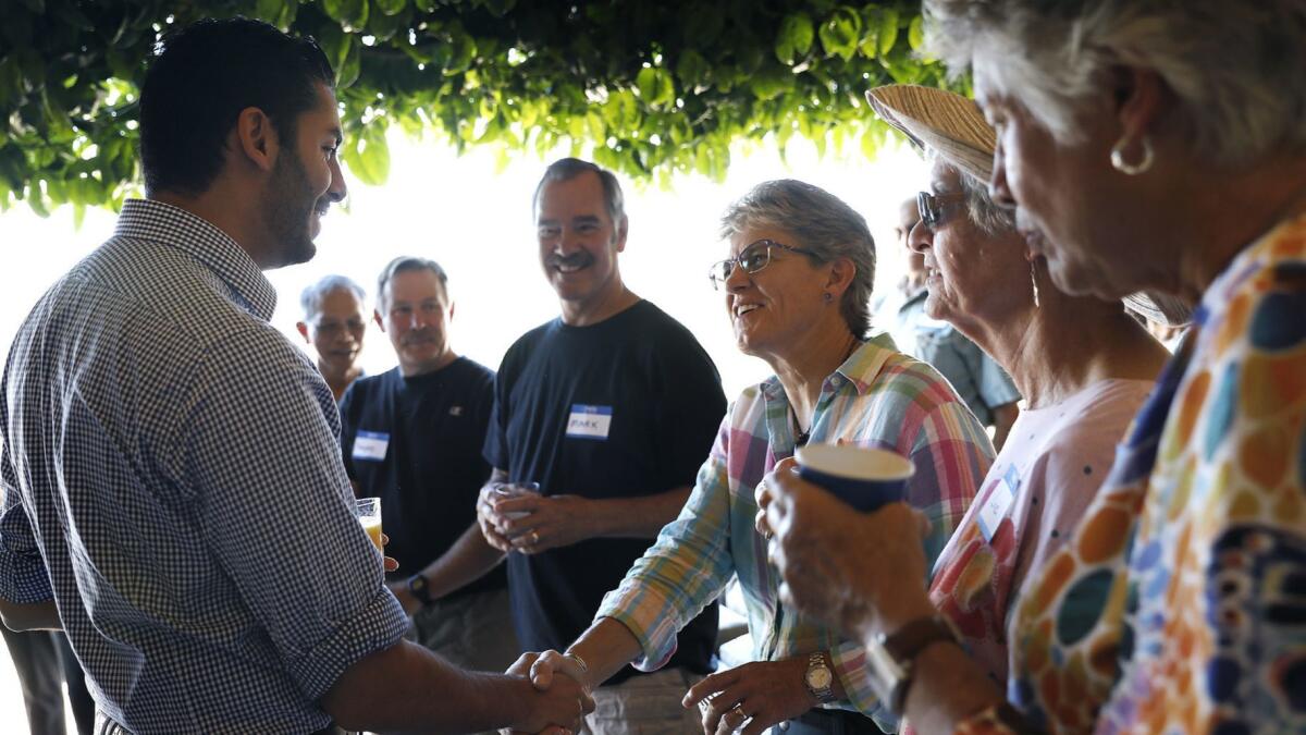 At a private home in Escondido, Ammar Campa-Najjar with Democrats who support his effort to turn a traditionally red district blue.