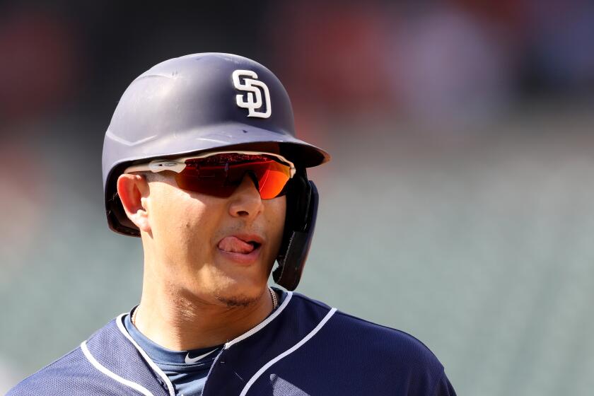 BALTIMORE, MARYLAND - JUNE 26: Manny Machado #13 of the San Diego Padres looks on from first base during a fifth inning pitching change against the Baltimore Orioles at Oriole Park at Camden Yards on June 26, 2019 in Baltimore, Maryland. (Photo by Rob Carr/Getty Images) ** OUTS - ELSENT, FPG, CM - OUTS * NM, PH, VA if sourced by CT, LA or MoD **