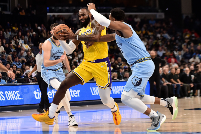  LeBron James #6 of the Los Angeles Lakers goes to the basket against Xavier Tillman.