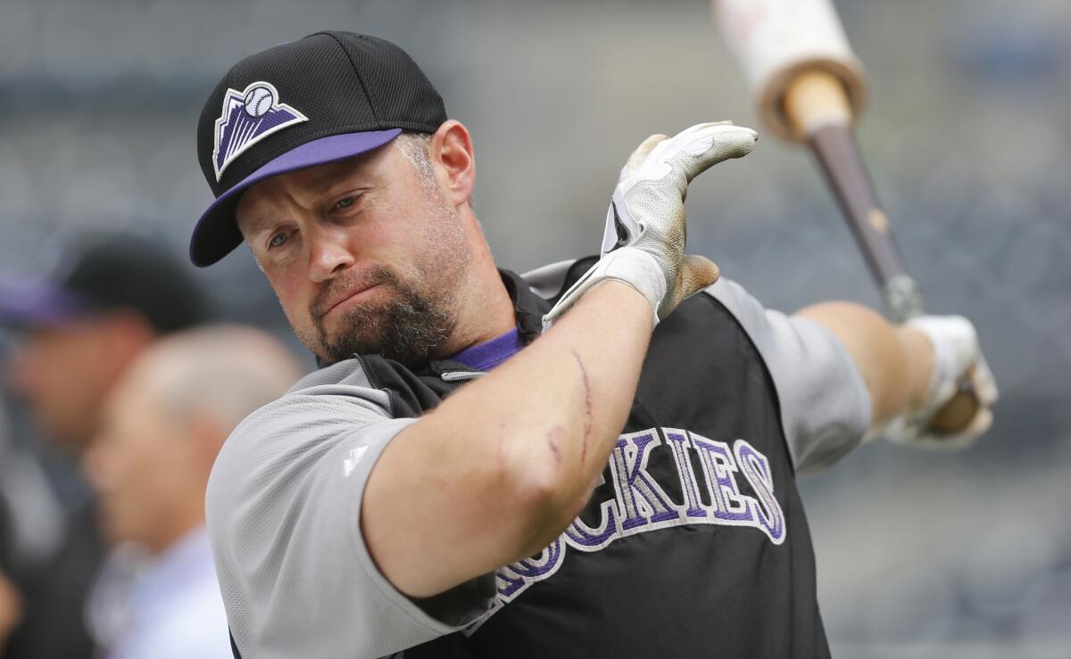 Colorado Rockies outfielder Michael Cuddyer warms up for batting practice prior to the start of a game against the San Diego Padres on Thursday.