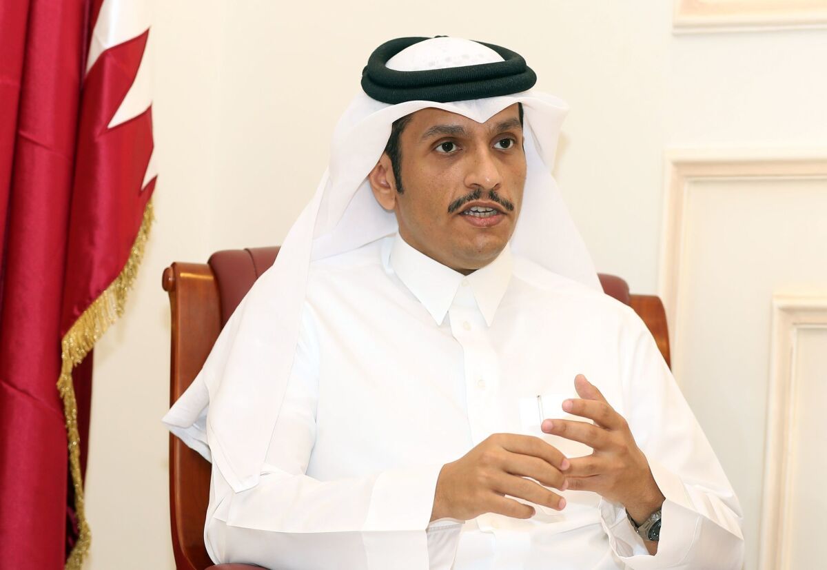 Qatari Foreign Minister Mohammed bin Abdulrahman al Thani speaks to a reporter in Doha on June 8.