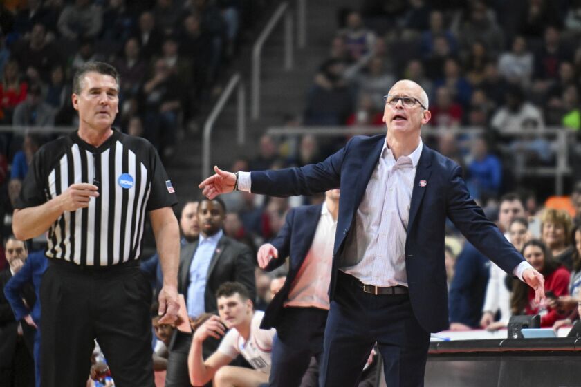 UConn head coach Dan Hurley, right, reacts after a play against Saint Mary's during the second half of a second-round college basketball game in the NCAA Tournament, Sunday, March 19, 2023, in Albany, N.Y. (AP Photo/Hans Pennink)
