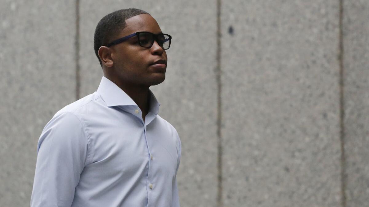 Former sports agent Christian Dawkins arrives at federal court in New York. Dawkins was found guilty along with Adidas executive Jim Gatto and former Adidas consultant Merl Code of funneling secret payments to families in federal corruption case.