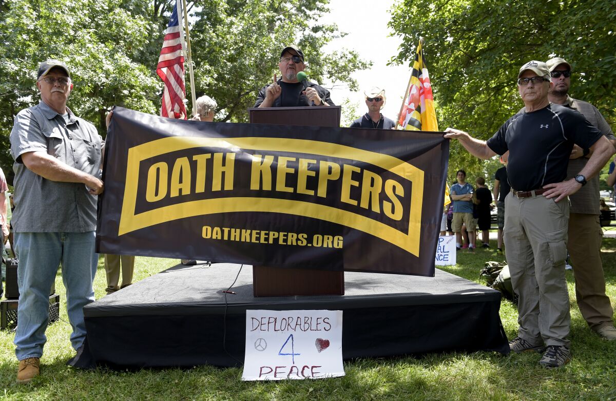 Oath Keepers founder Stewart Rhodes, center, speaks during a rally outside the White House in 2017.