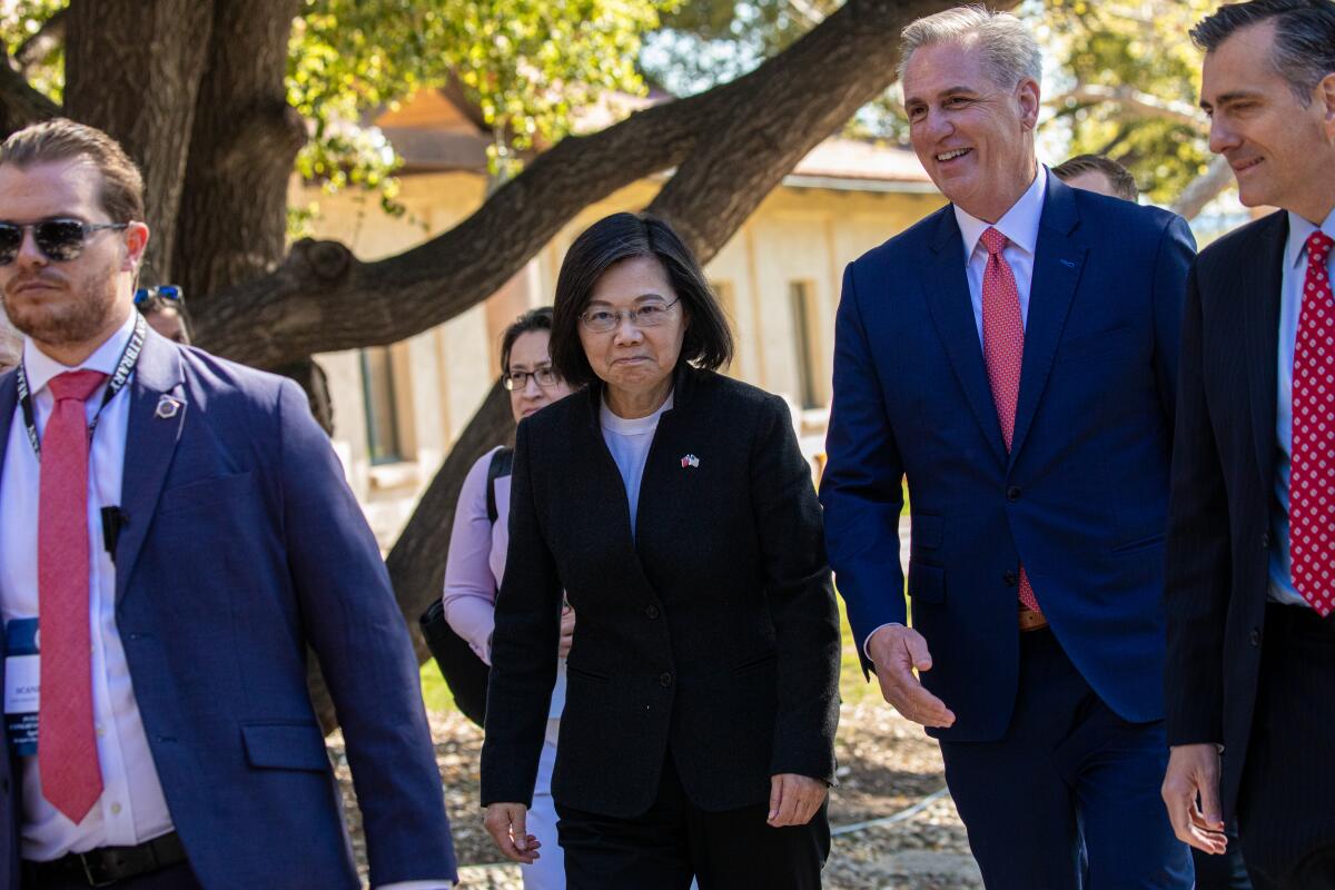 House Speaker Kevin McCarthy walks with Taiwan President Tsai Ing-wen.