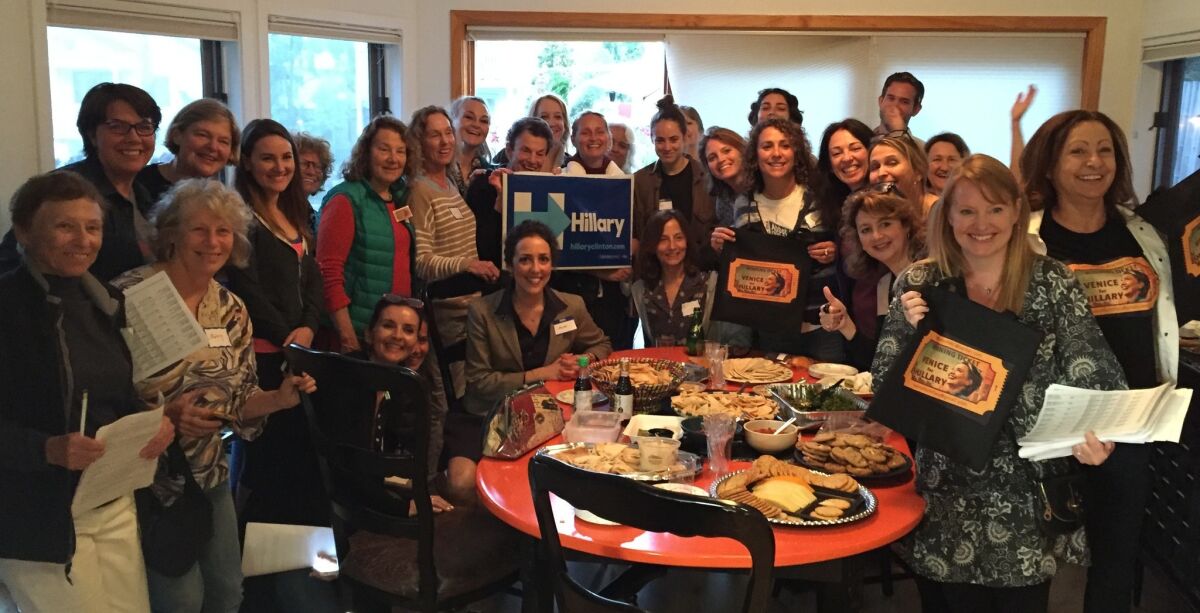 Volunteers at a Hillary Clinton phone bank celebrate making more than 2500 calls in two hours