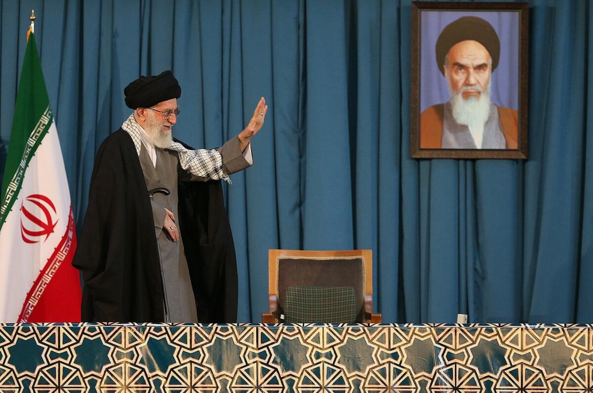 Ayatollah Ali Khamenei, Iran's supreme leader, waves on Saturday to the crowd attending the celebrations of the Persian New Year in the northeastern city of Mashhad.