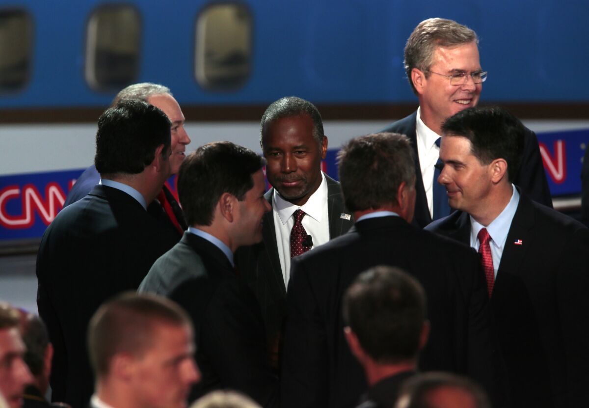 Republican presidential candidates shake hands at the end of the GOP debate at the Reagan Library in Simi Valley.