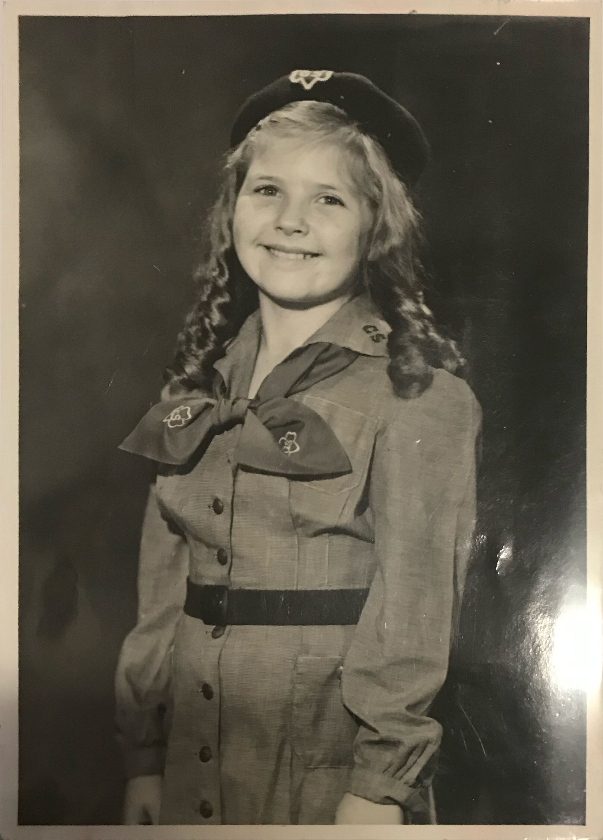 Lora Lee Michel wearing a Girl Scout uniform.