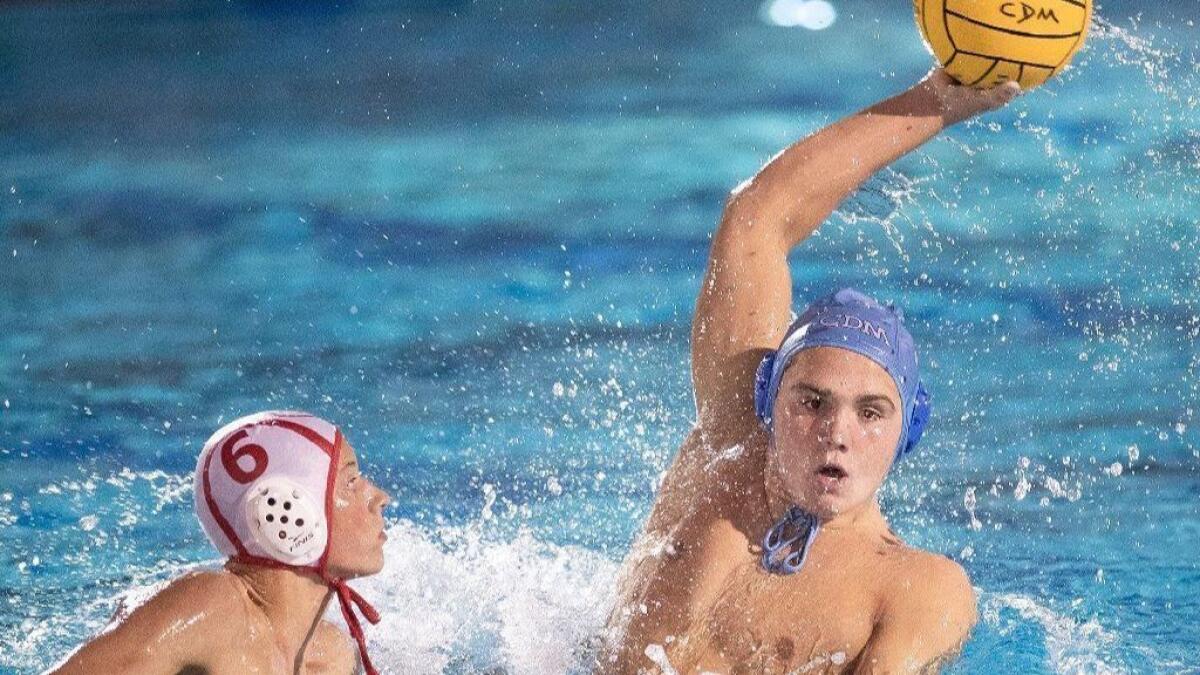 Corona del Mar High's Tanner Pulice, seen looking to take a shot against Orange Lutheran on Aug. 30, scored five goals to lead the Sea Kings to a 13-7 nonleague win at Riverside Poly on Saturday.