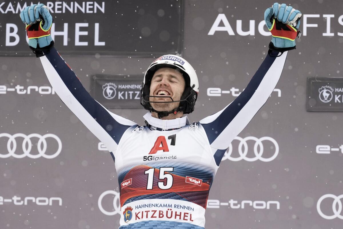 Britain's Dave Ryding celebrates winning an alpine ski, men's World Cup slalom, in Kitzbuehel, Austria, Saturday, Jan. 22, 2022. (AP Photo/Giovanni Auletta)
