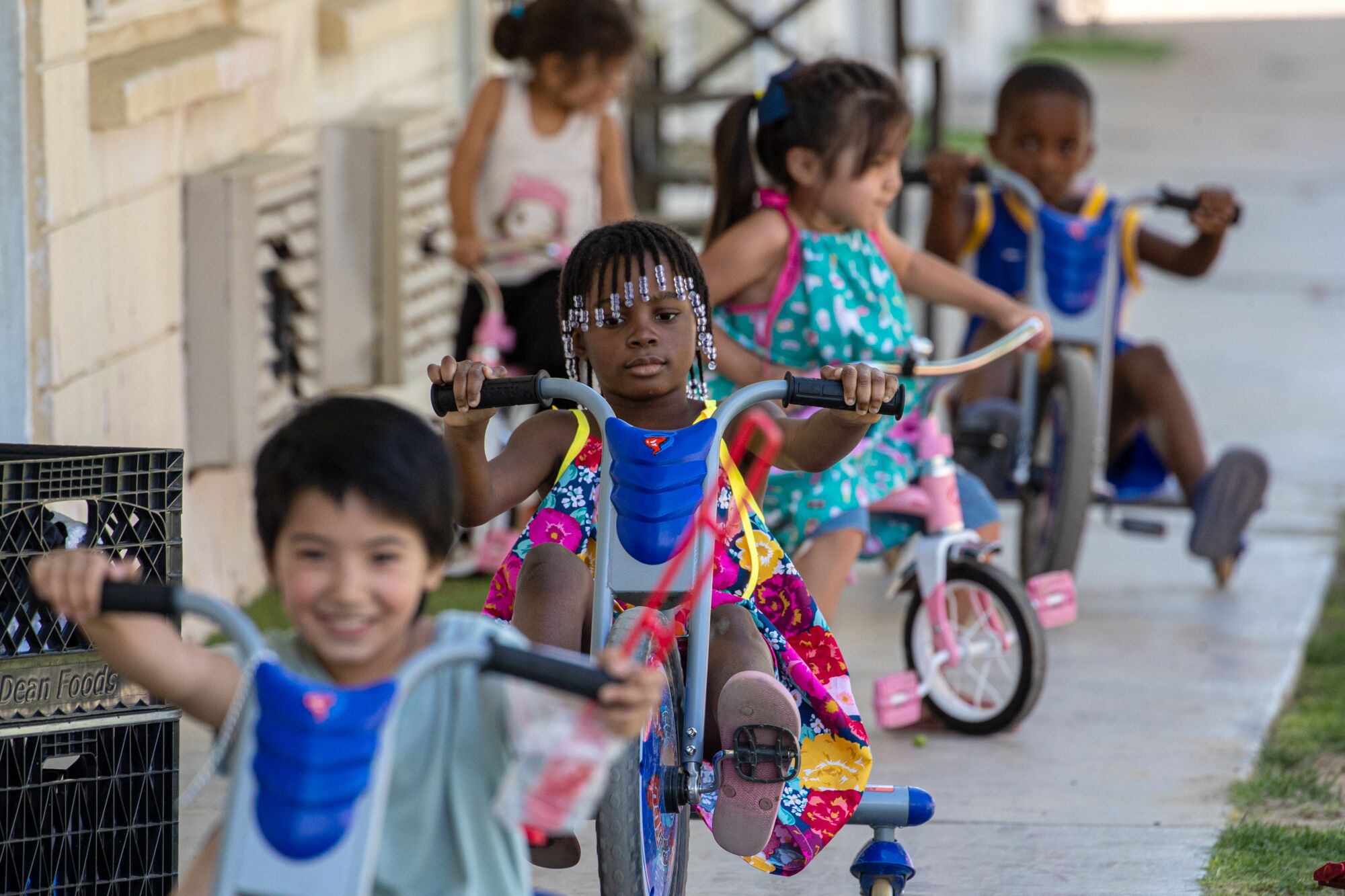 Children on tricycles at the shelter  in Riverside County.