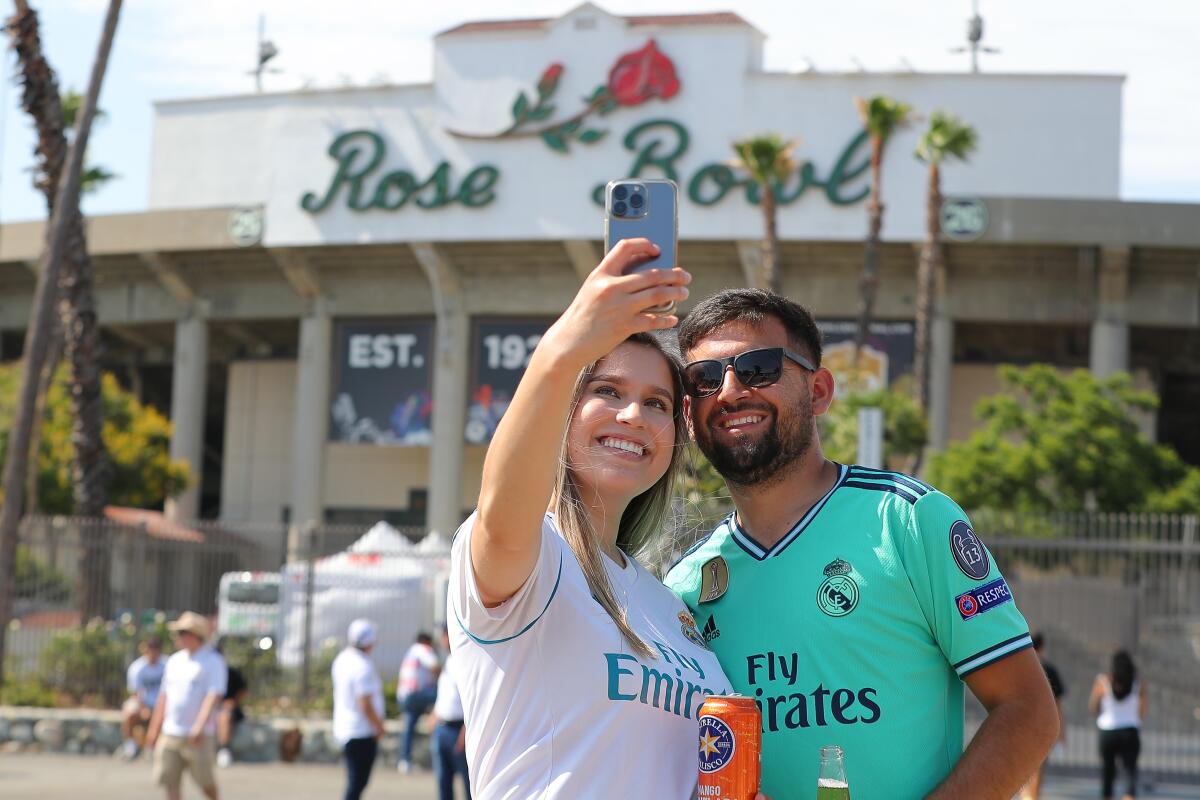 Real Madrid fans take selfie before Saturday's match between Real Madrid and Juventus at the Rose Bowl.