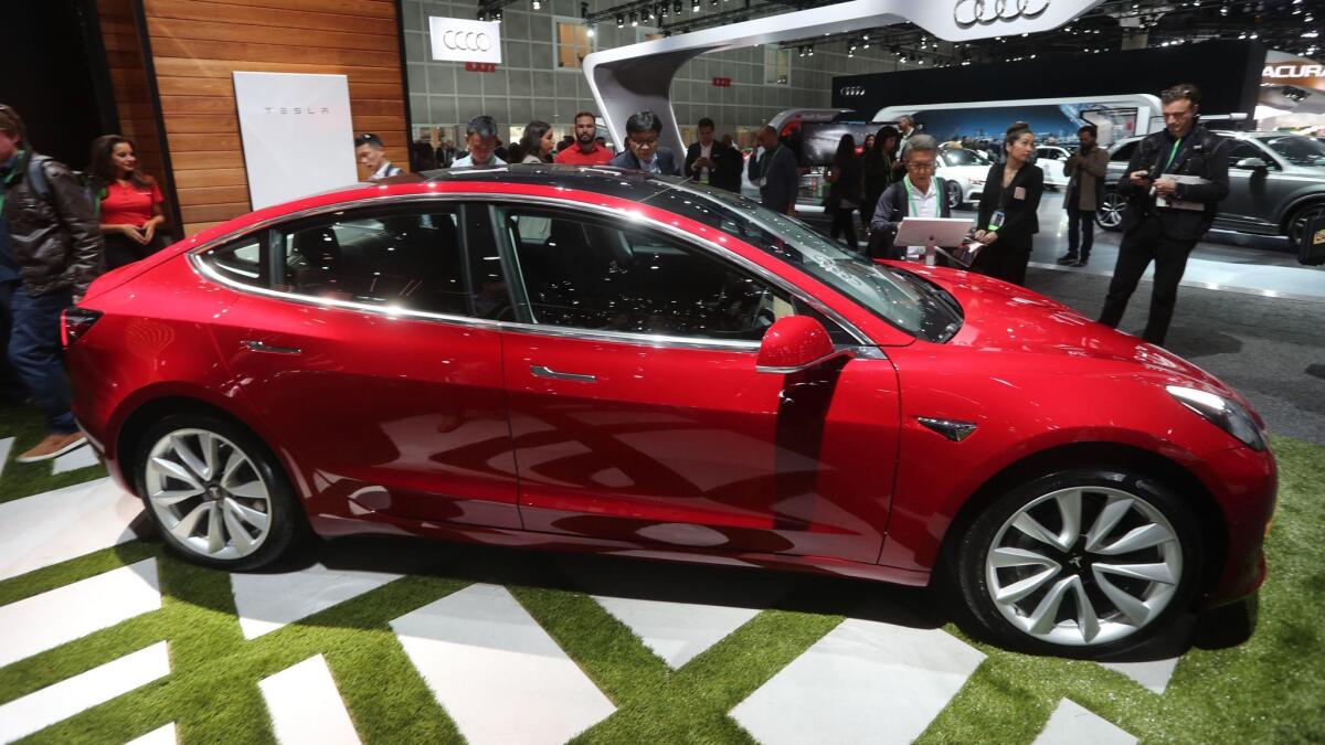 The Tesla Model 3 is displayed at the Los Angeles Auto Show in November.
