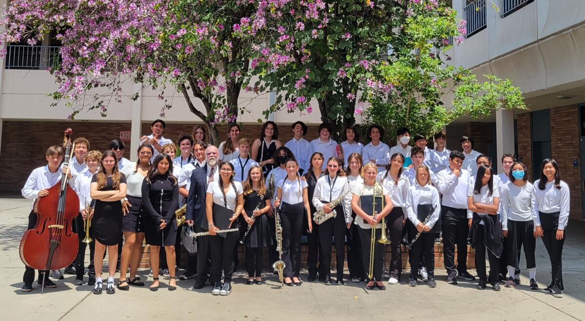 Pacific Beach Middle School Concert Band and Orchestra members with director John O’Donnell at “Music in the Parks” festival.