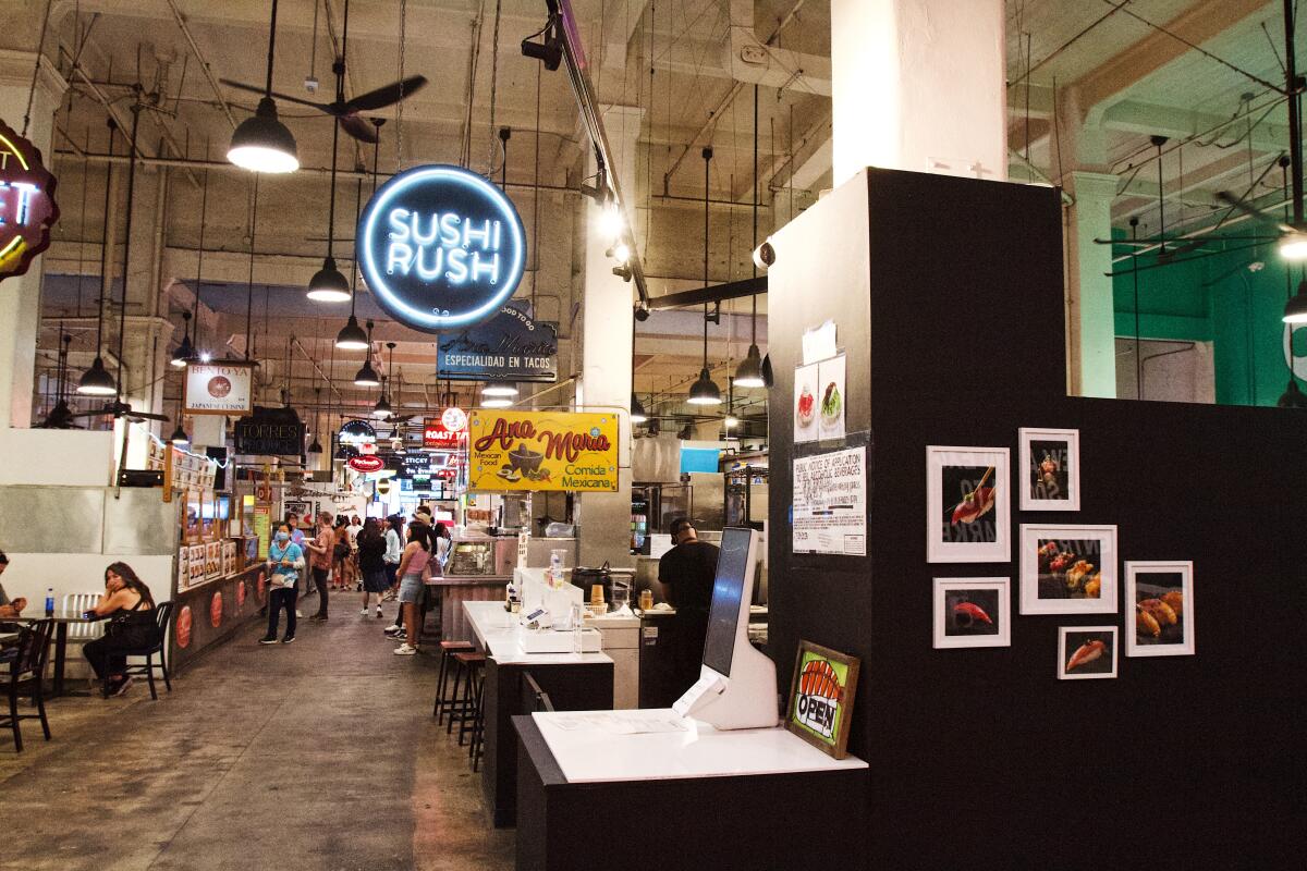 A photo of the food stall Sushi Rush amidst the array of stalls in Grand Central Market