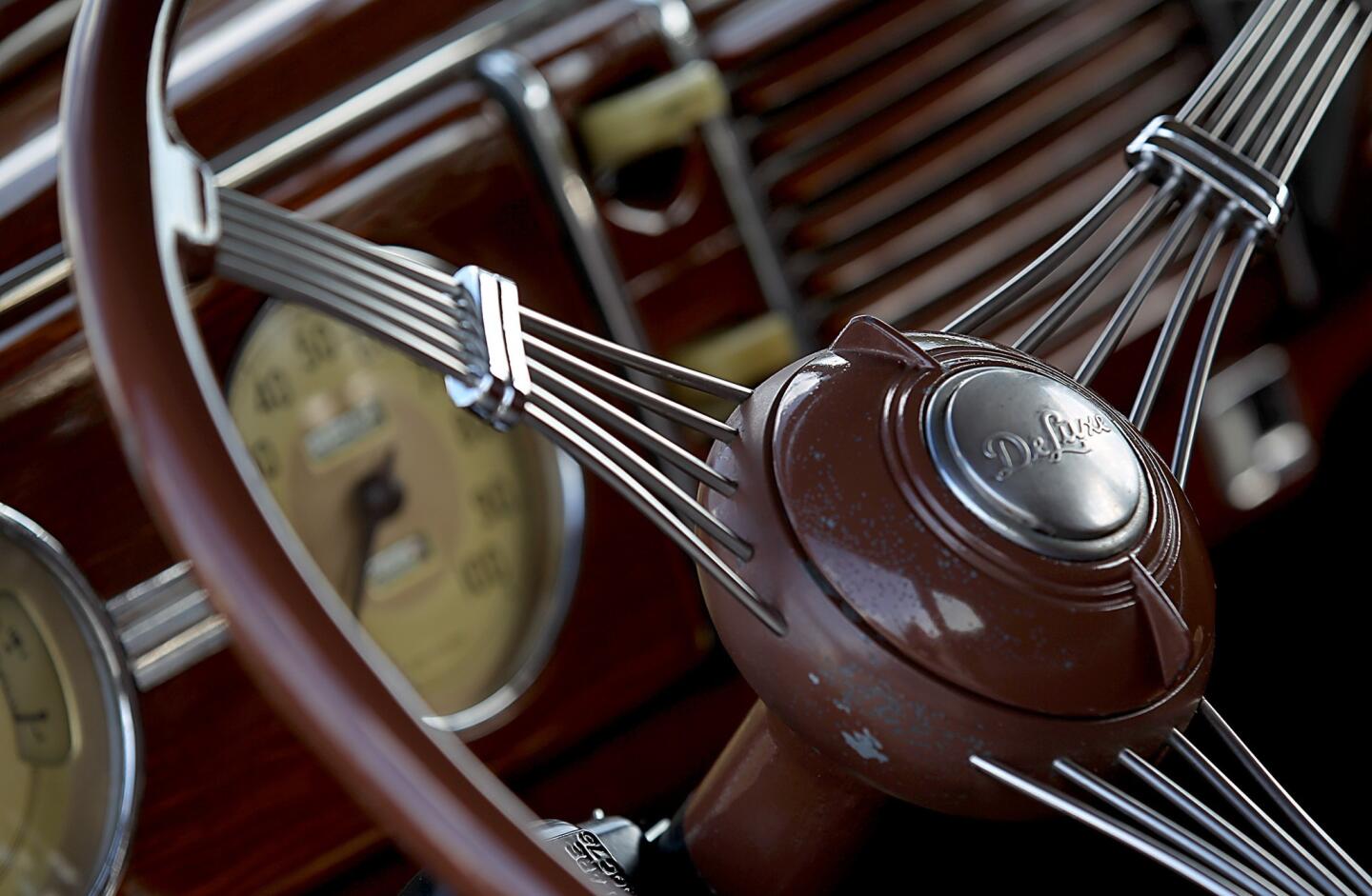 The interior of a club member's rare 1939 Ford Deluxe four-door convertible includes what is known as a banjo steering wheel.