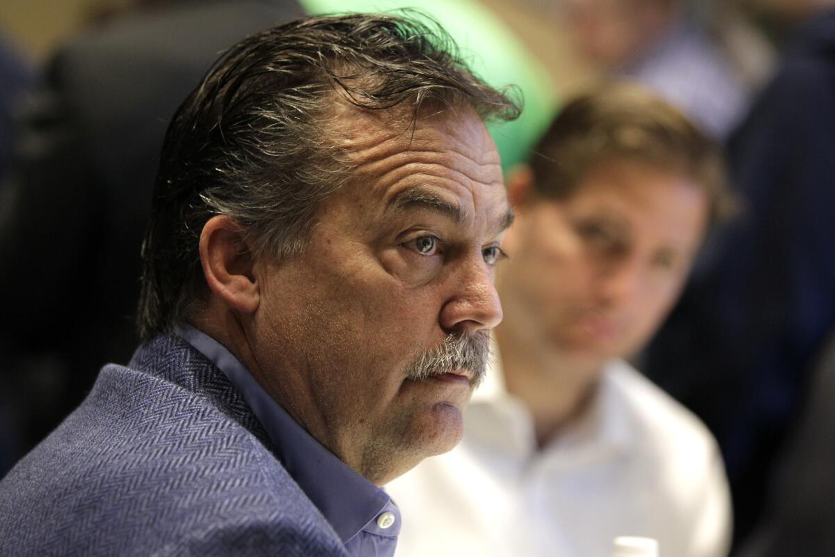 Jeff Fisher talks to reporters Wednesday at the NFL owners meeting in Boca Raton, Fla.