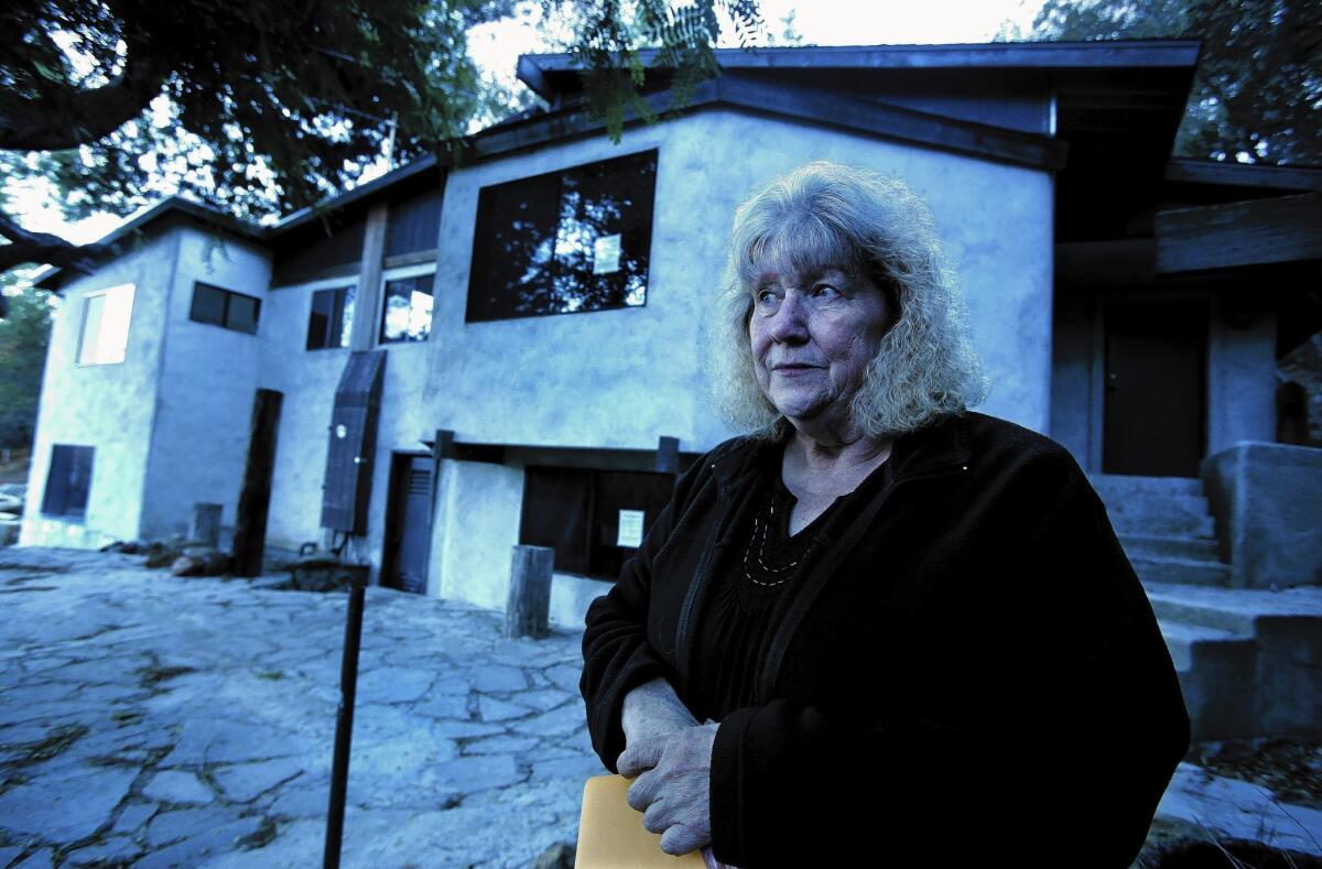Joanne Finazzo, 67, had to move out of her home after Calabasas slapped the property with code violations and it ended up in foreclosure. The bank is expected to raze it. She and other owners of older homes say they think they're being unfairly targeted.