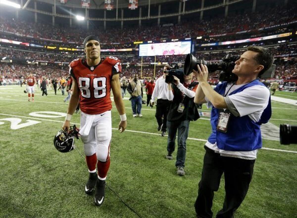 Tony Gonzalez walks off the field for perhaps the final time.