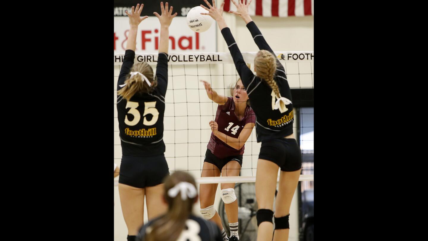 Laguna Beach High's Piper Naess (14) competes against Foothill during set two in a nonleague match in Santa Ana on Wednesday, Sept. 5.