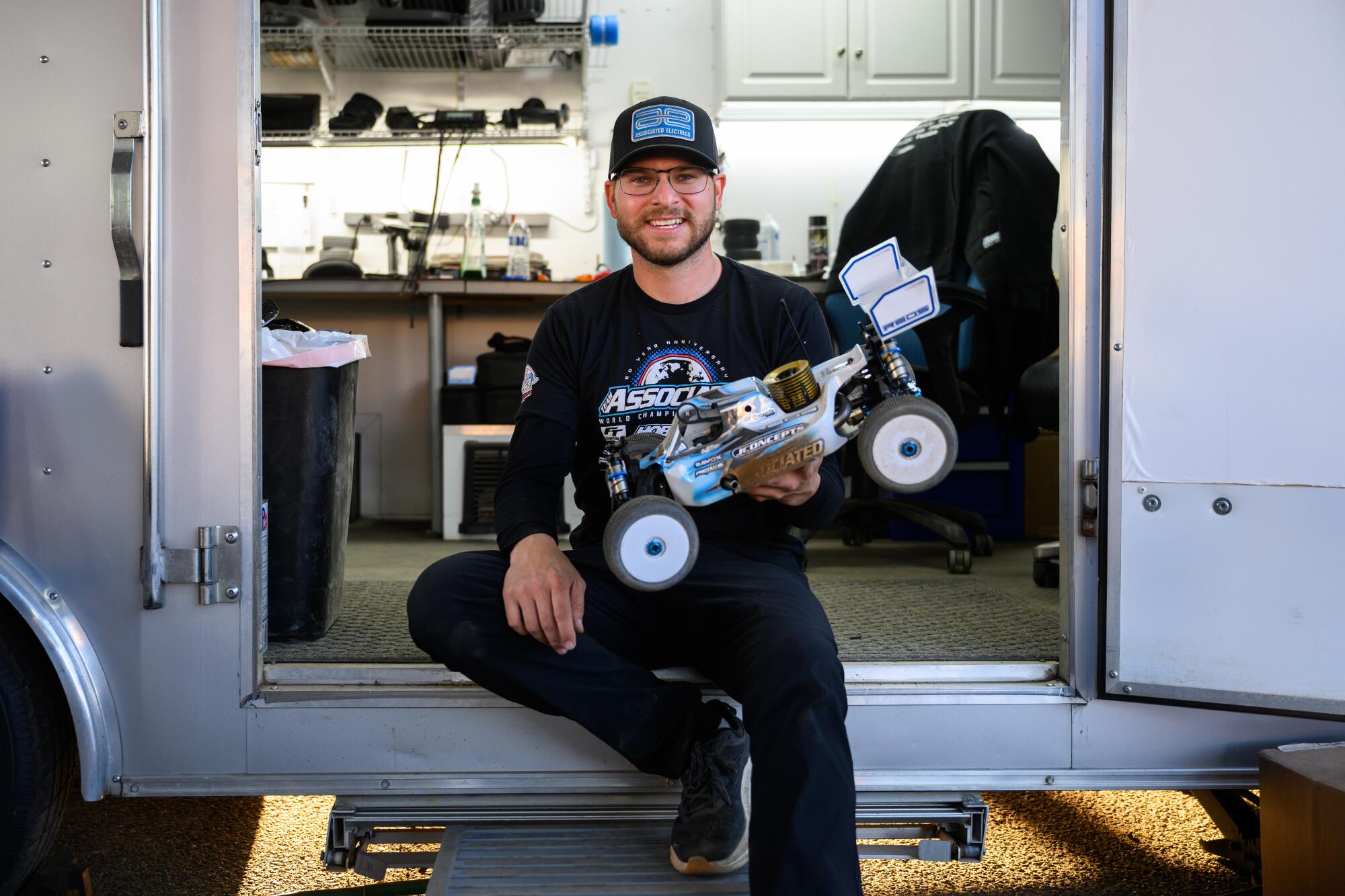 Spencer Rivkin poses for a portrait with his RC car during the annual Dirt Nitro Challenge.