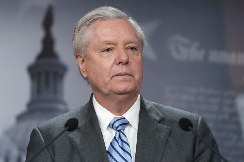 FILE - Sen. Lindsey Graham, R-S.C., speaks with reporters about aid to Ukraine, on Capitol Hill, Wednesday, March 10, 2022